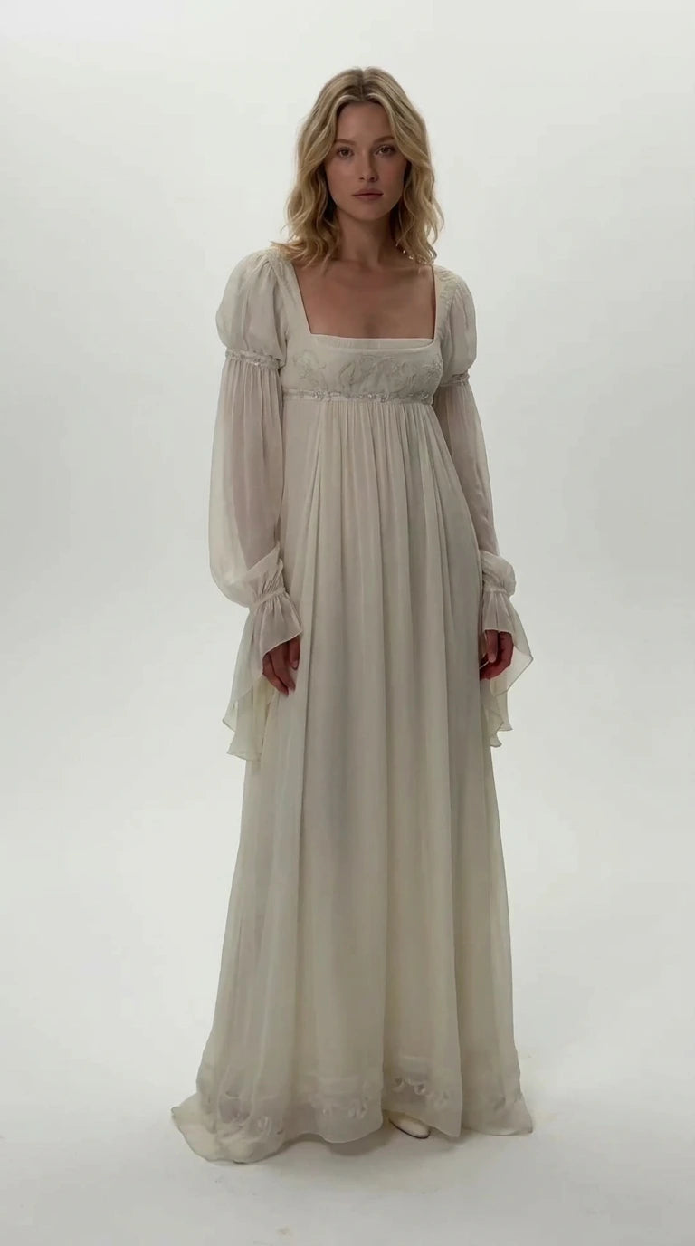 Front view of model wearing ivory Regency empire waist chiffon maxi dress
