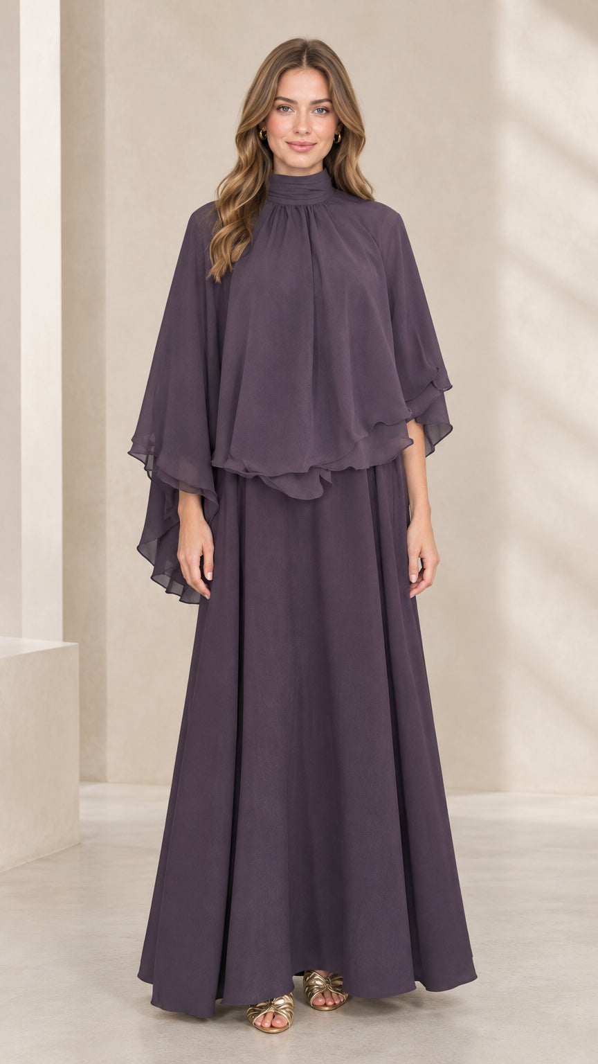 Front view of woman wearing dusty plum mock neck capelet maxi dress