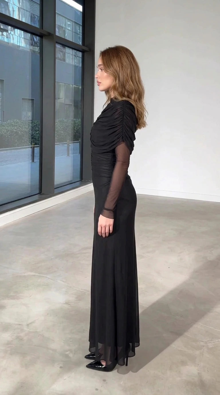 Side view of black ruched mock neck evening dress