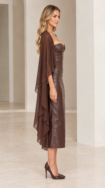 Side view of model wearing brown faux leather midi dress showcasing cascading chiffon cape sleeves