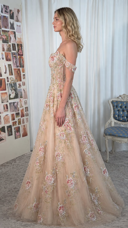 Side profile view of Champagne tulle ball gown with floral lace applique