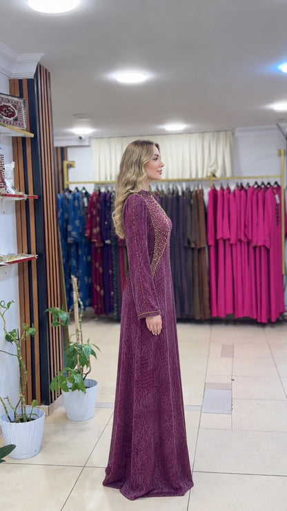 Side profile view showing the modest silhouette of the plum gown