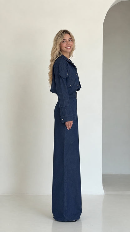 Side profile view of navy blue cropped jacket and high-waisted wide-leg pant set