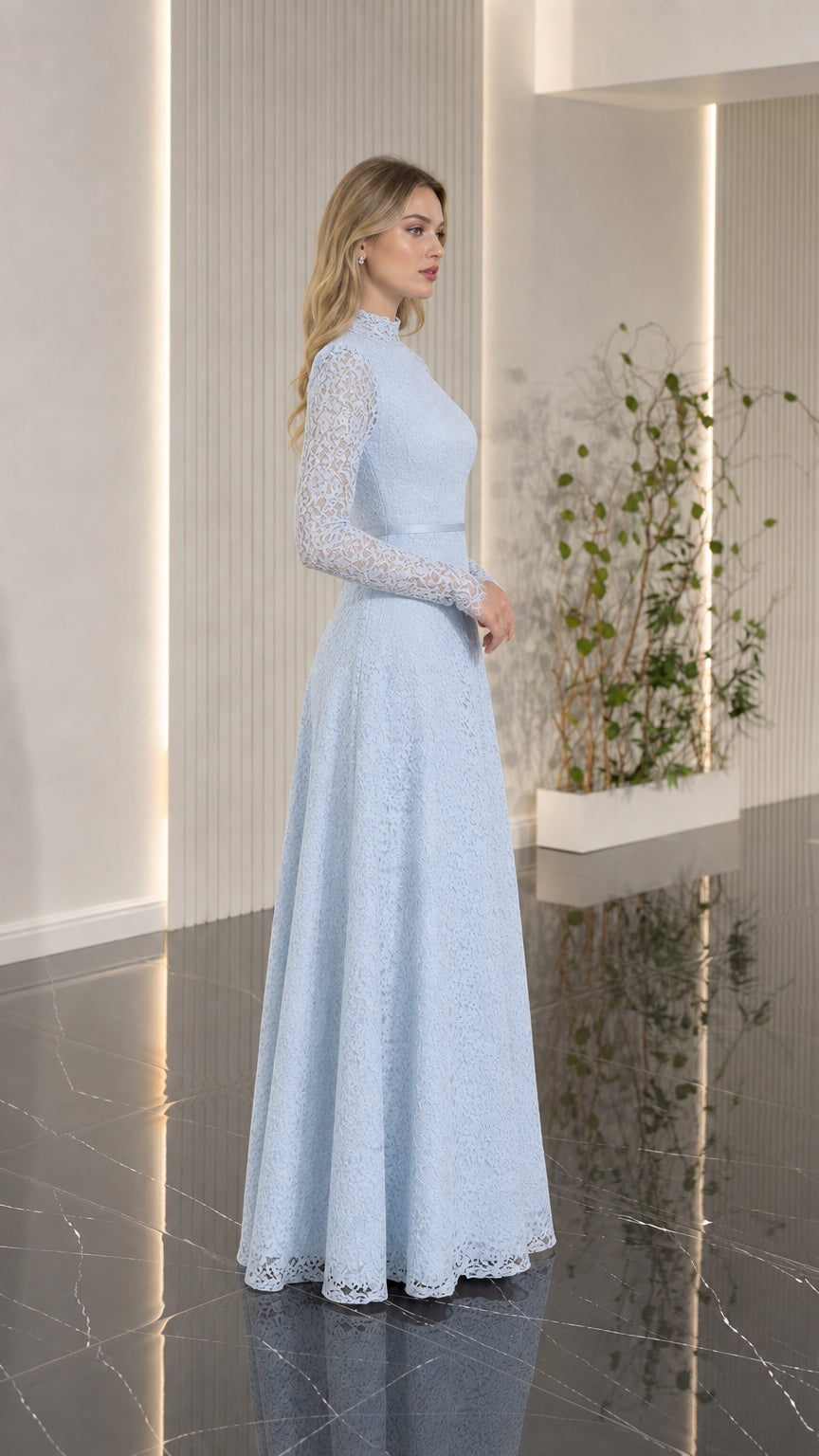 Side profile view of woman modeling light blue lace evening gown