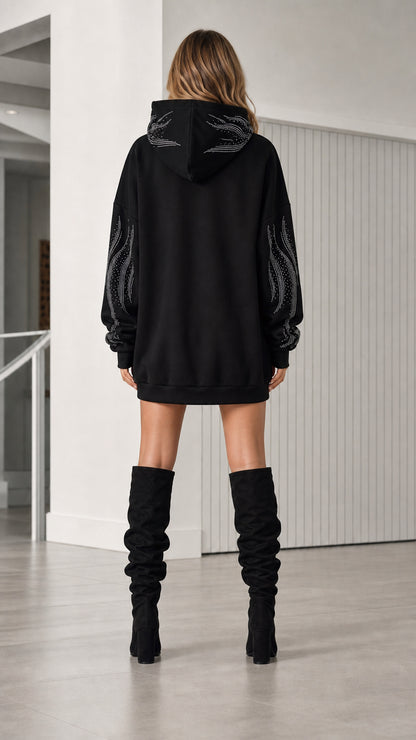 Back view of model in black rhinestone hoodie dress