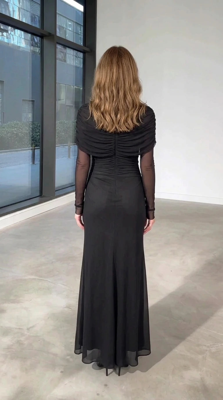 Back view of black long sleeve formal maxi dress