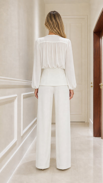 Model wearing white two-piece set back view