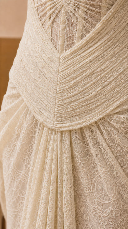 Close-up detail of the structured bodice and intricate lace texture