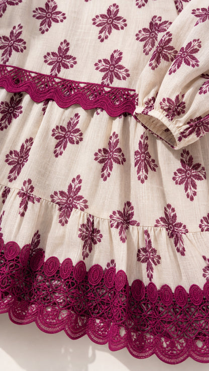 Close-up detail of embroidered hem and fabric texture