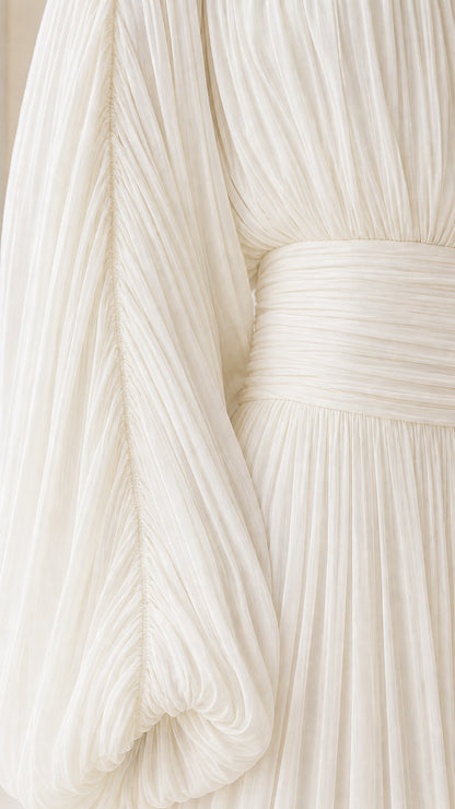 Close-up detail of pleated chiffon fabric and gathered waistband