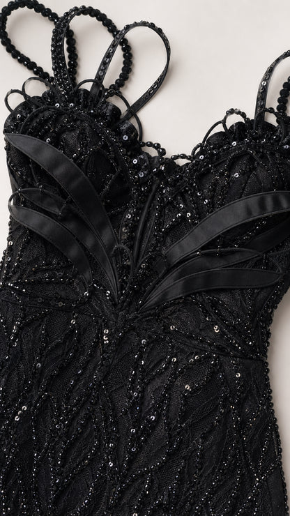 Close-up detail of beaded bodice, sweetheart neckline, and decorative straps
