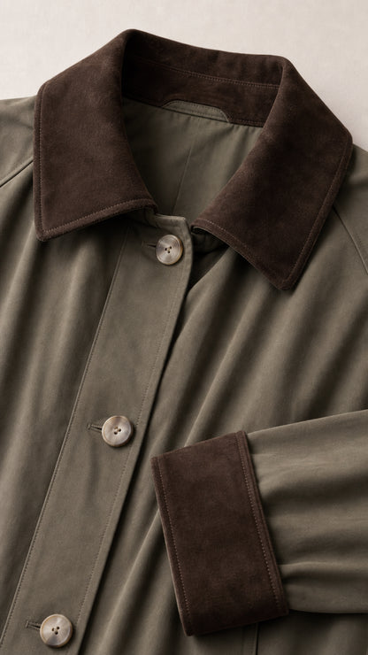 Close-up detail of dark brown contrast collar, button placket, and fabric texture
