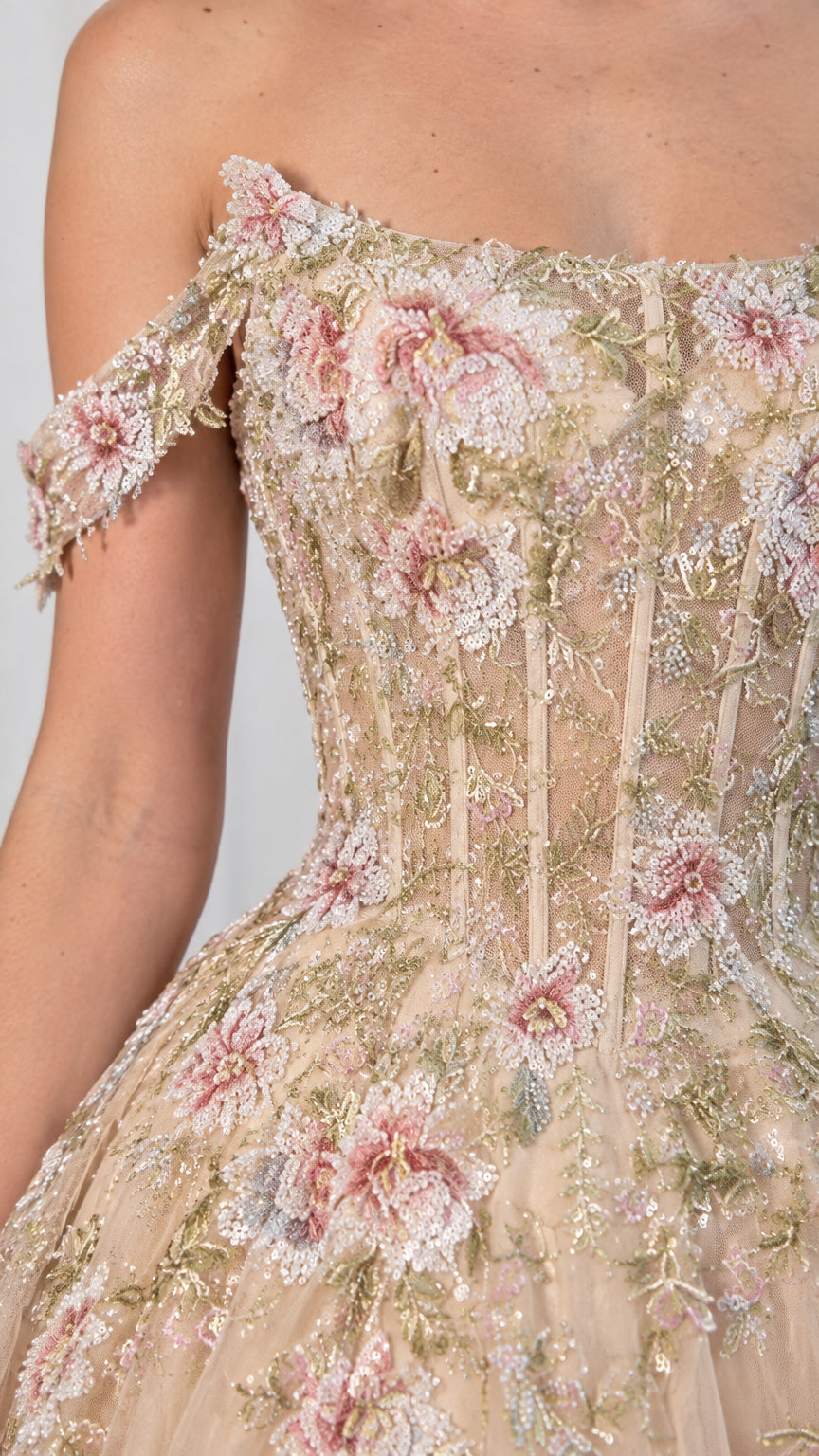 Close-up detail of embroidered corset bodice and off-shoulder straps