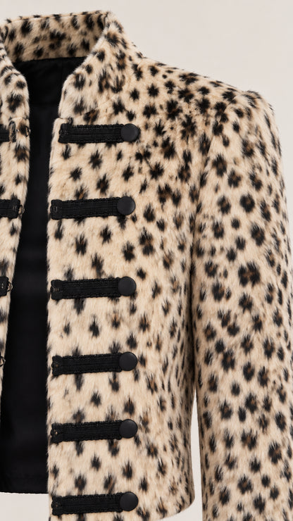 Close-up detail of textured fabric and black military frog fastenings on Beige Leopard jacket