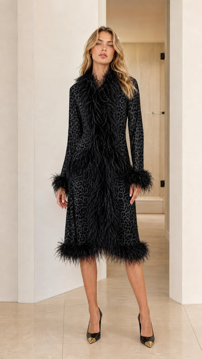 Model wearing the black leopard print midi coat with matching black feather trim