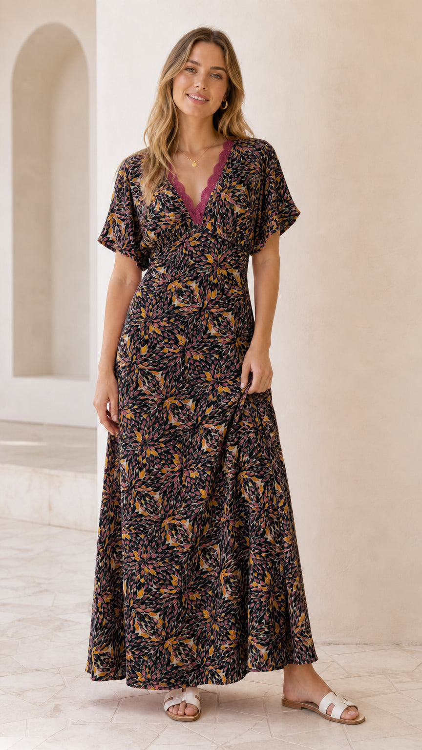 Front view of model wearing black floral lace trim maxi dress