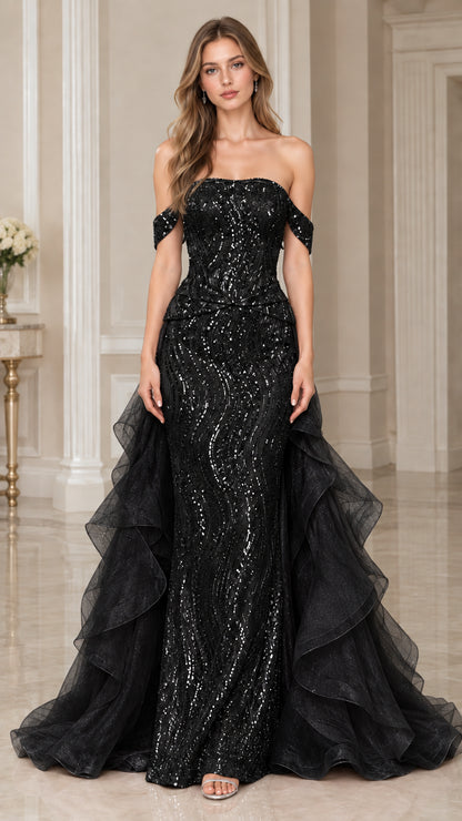 Front view of model wearing Black sequined off-the-shoulder mermaid gown with cascading ruffles
