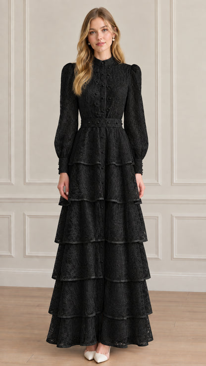 Model wearing black long sleeve high neck tiered lace maxi evening dress