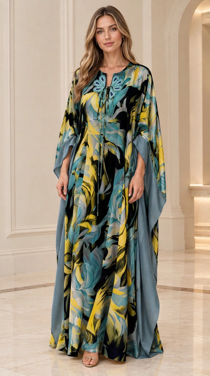 Full-length front view of black and teal floral caftan maxi dress