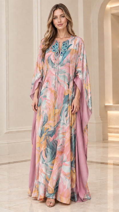 Full-length front view of pink and mauve watercolor print caftan dress