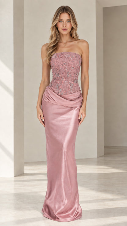 Model wearing dusty rose strapless beaded corset satin evening gown