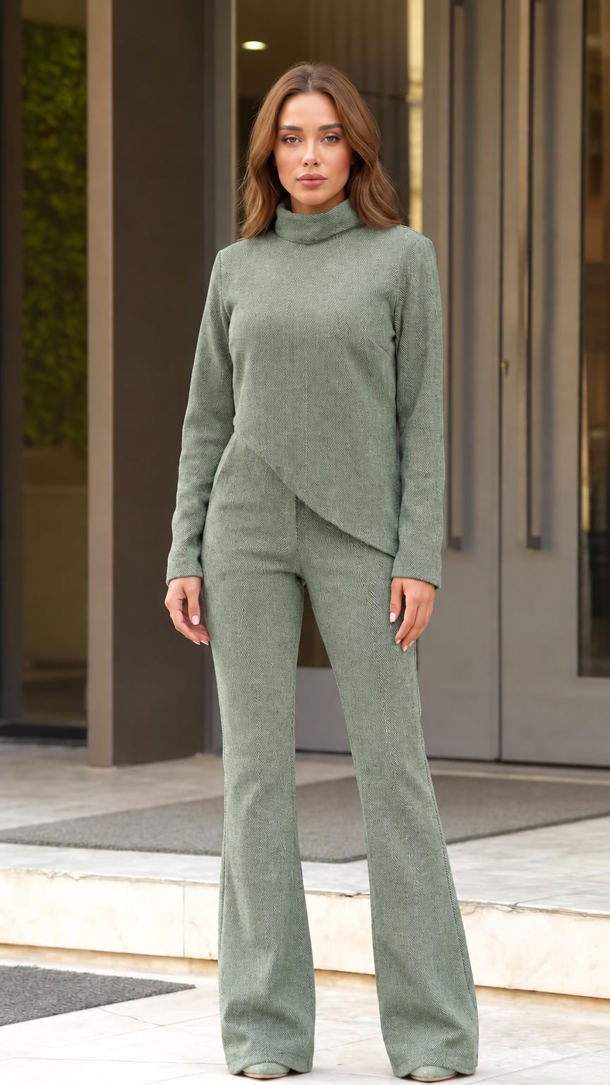 Front full view of woman wearing sage green asymmetric top and flared pants set