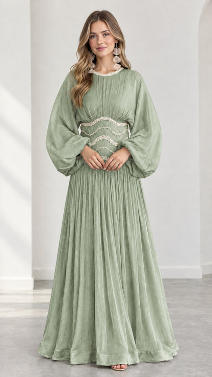 Model wearing sage green pleated balloon sleeve formal maxi dress