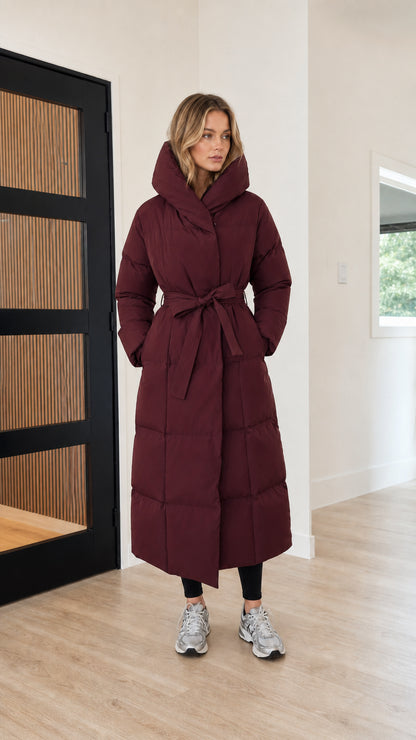 Women's belted long quilted winter parka in deep burgundy