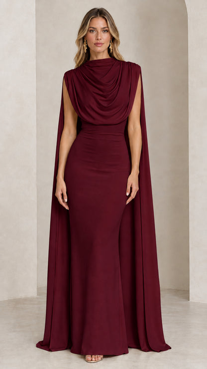 Front view of model wearing the burgundy draped cowl neck cape evening gown