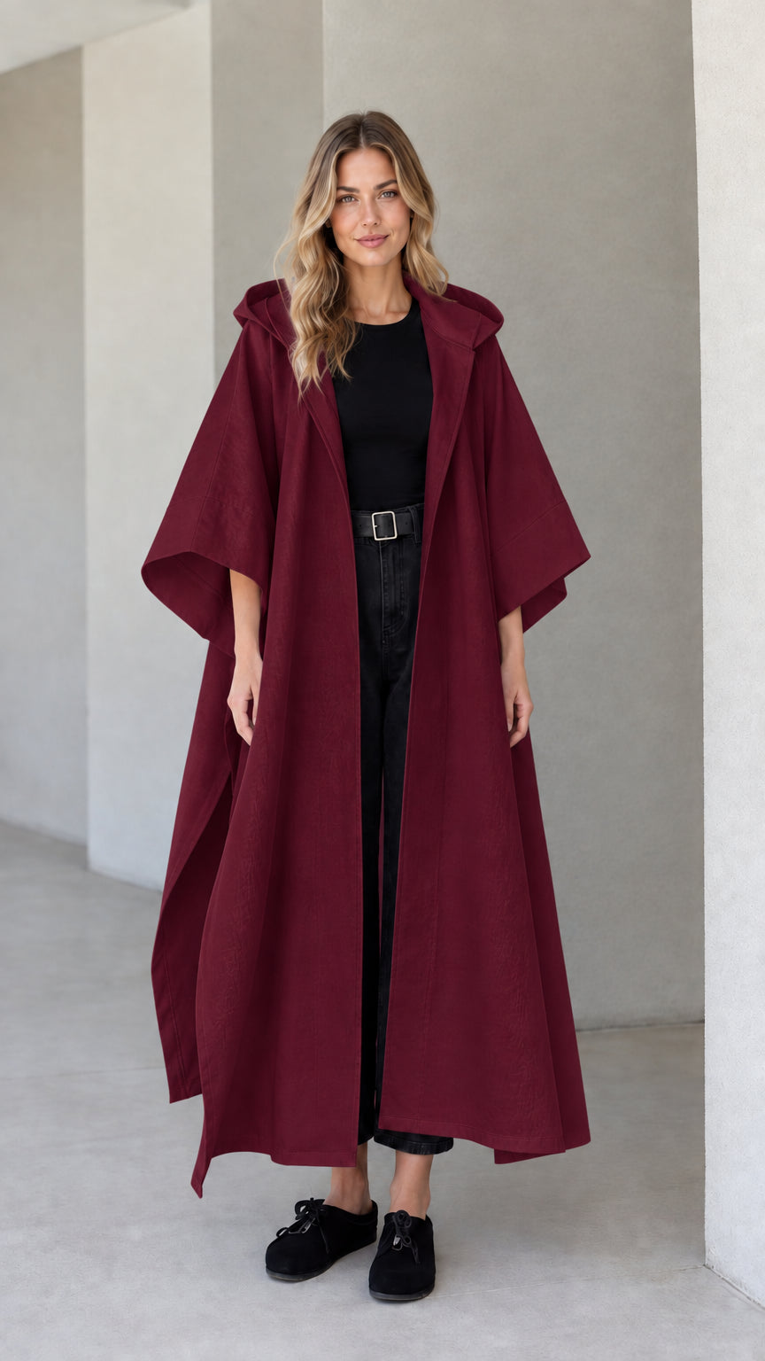 Model wearing burgundy wine red hooded maxi canvas cape coat