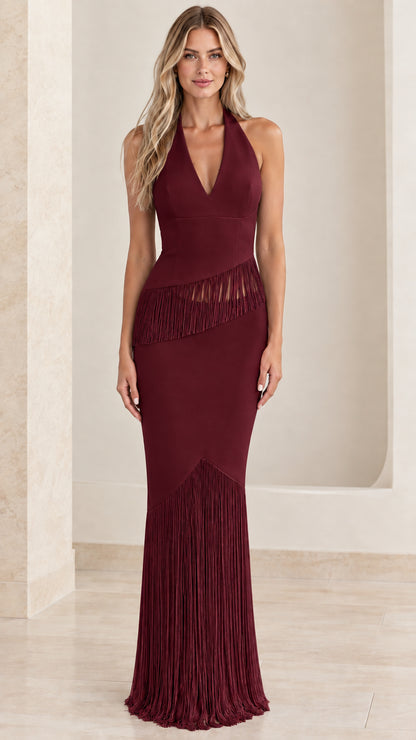 Front view of model wearing burgundy halter fringe evening dress