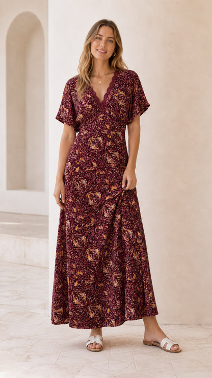 Front view of model wearing burgundy floral lace trim maxi dress