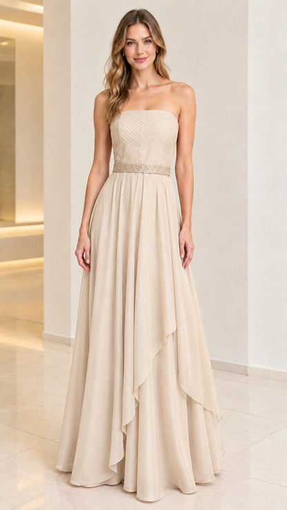 Front view of woman wearing champagne beige strapless A-line formal gown