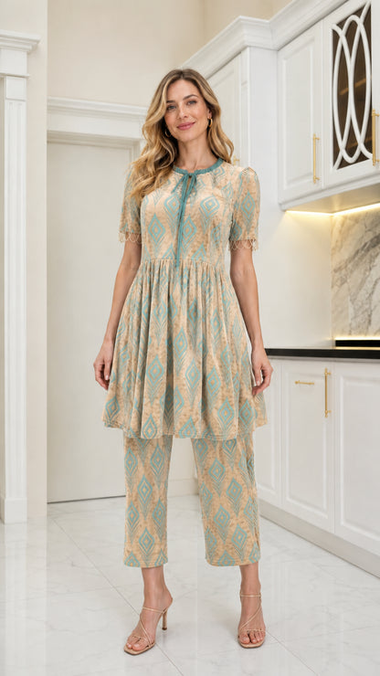 Front view of model wearing Beige geometric velvet babydoll tunic and pant set