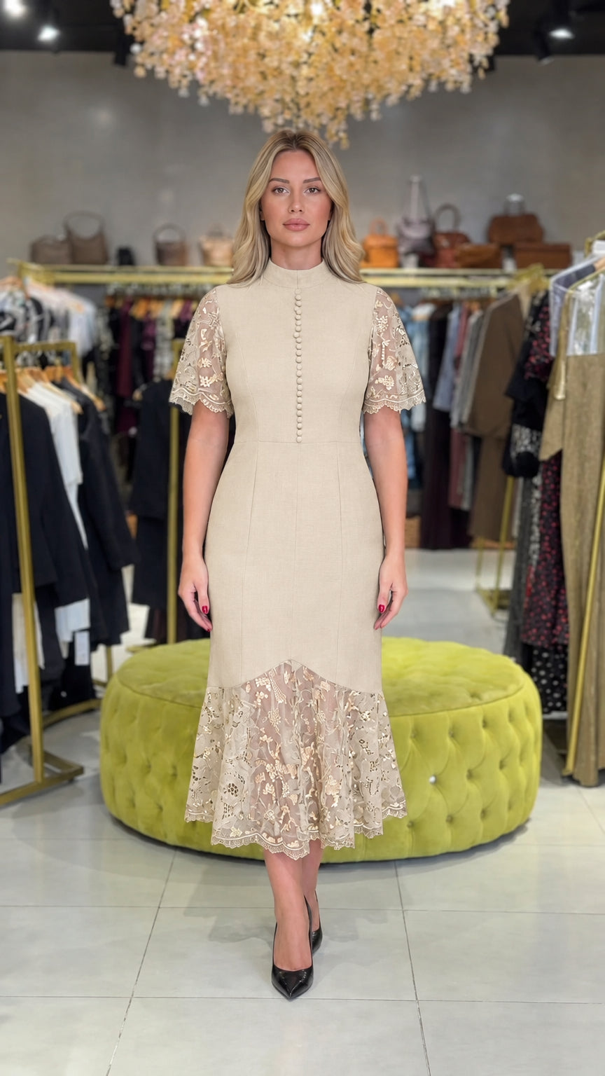 Model wearing champagne beige mock neck lace midi cocktail dress
