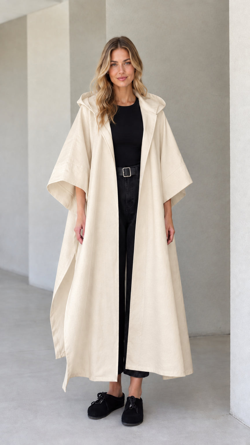 Model wearing cream beige hooded maxi canvas cape coat