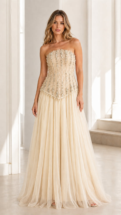 Front view of champagne embellished strapless tulle evening gown